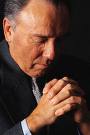 older man praying